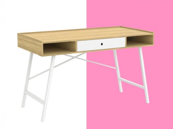 A mid-century modern desk with a sleek table top, contrasting white middle drawer, and matching white metal legs