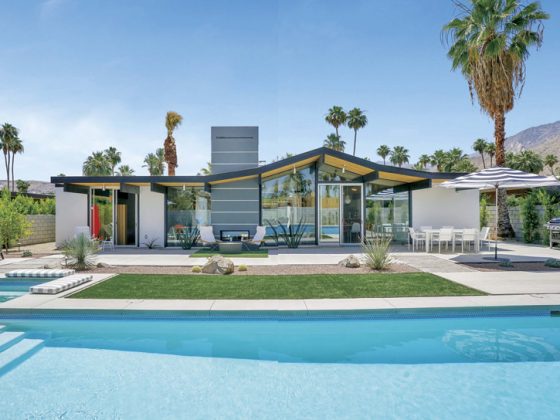 A home's exterior showcasing its mid century backyard.