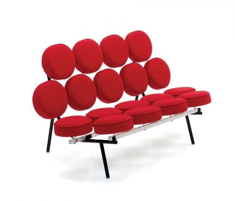 A Herman Miller red sofa composed of several circular cushions.