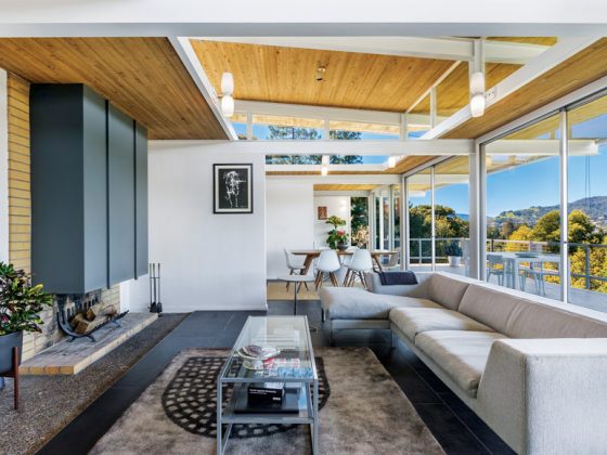 The living room of Case Study House #26, showcasing its natural clerestory and rectangular fireplace.