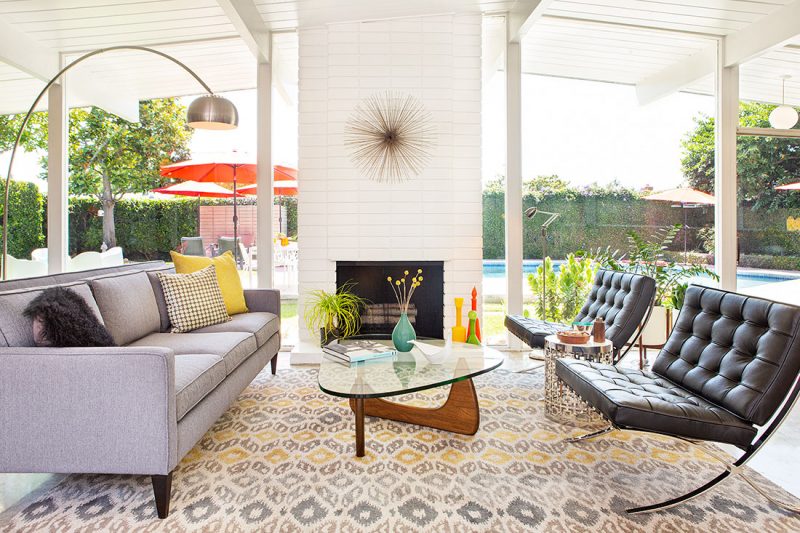 Living room with larage windows and mid century furniture