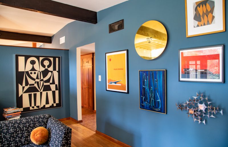 blue wall with mid century modern art