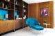 blue Womb chair and wall unit bookshelf