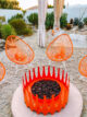 Krisel Palm Springs backyard orange firepit and Acapulco chairs