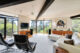 Open living room with paneled ceiling and sleek leather seating.