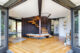 Wide lens photo of the parallelogram shape of this California home, highlighting the spiral staircase in the middle.