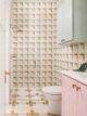 Project House Austin bathroom with pink and gray cabinets