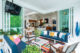 Outdoor patio with bright colors and striped rug