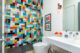 Mid-century modern design tiles in bathroom shower with glass doors