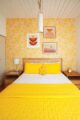 Yellow bed in Dani Nagel's Krisel home