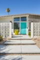 entryway with breeze block lime green planter and turquoise door with diamond detail