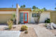 MCM exterior with breeze block green trim and orange doorframe