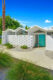 accordion roof home with turquoise door