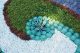 succulent and gravel swirl plant bed