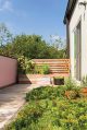 modern backyard with built-in wooden plant