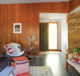 LVP flooring and wood paneled walls in 1950s Wisconsin home
