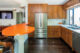 stainless steel appliances in renovated MCM kitchen
