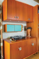 record player and sapele wood storage cabinetry in 1960s home