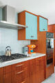 MCM 1960s home renovated kitchen with sapele wood cabinetry
