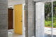 yellow door in entryway of MCM Florida home