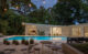 MCM St. Petersburg back exterior pool and view inside L-shaped home