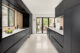 Cabinetry and windows in a kitchen.