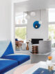 blue accents with walnut side tables in Palm Springs Krisel home with Butterfly roof