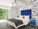 black and white bedroom with cobalt blue headboard